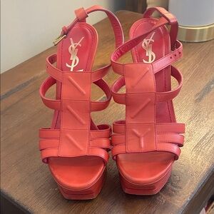 Yves Saint Laurent
Tribute leather sandals- red/coral color